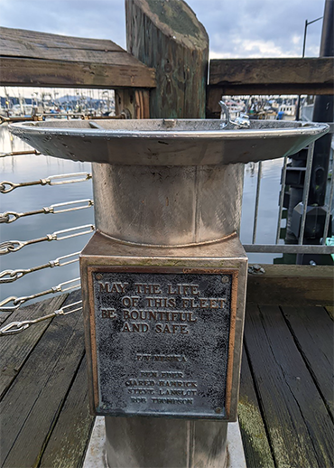 Fountain honoring F/V Nesika with plaque that reads "May the life of this fleet be bountiful and safe"